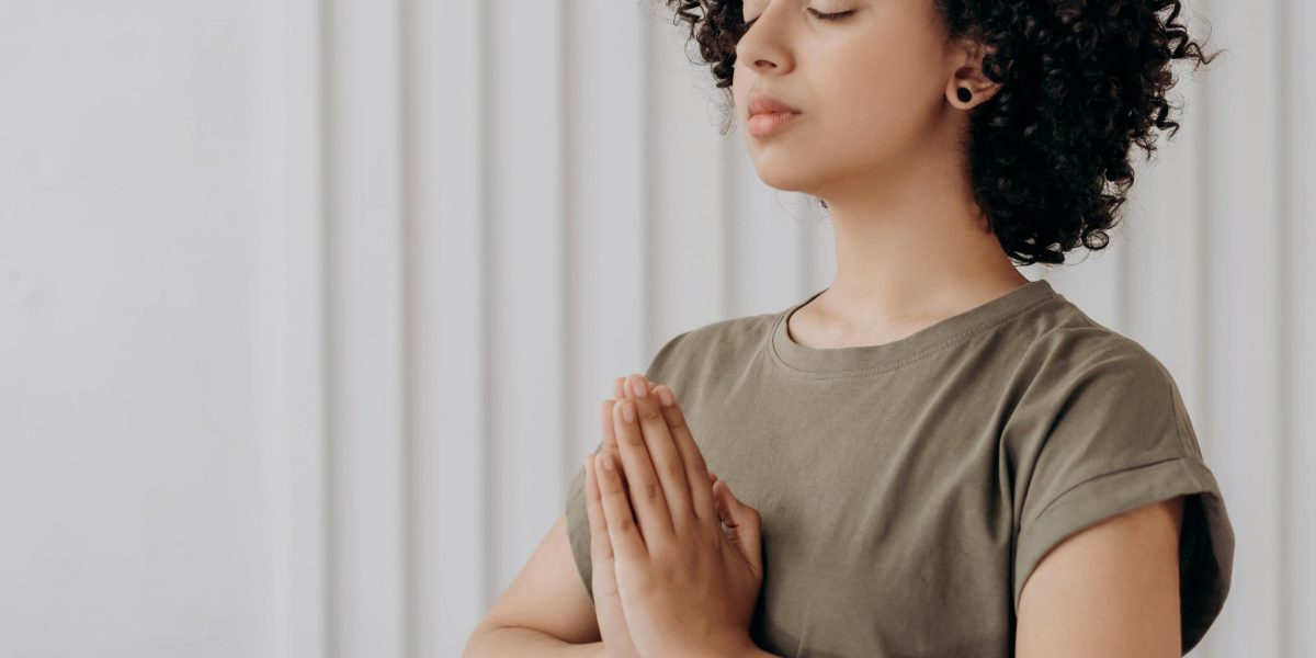 A person experiencing a sense of calm and relaxation, perhaps after a meditation session.