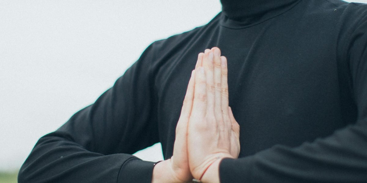 A person demonstrating focused, deep breathing, highlighting the calming effect on the nervous system.