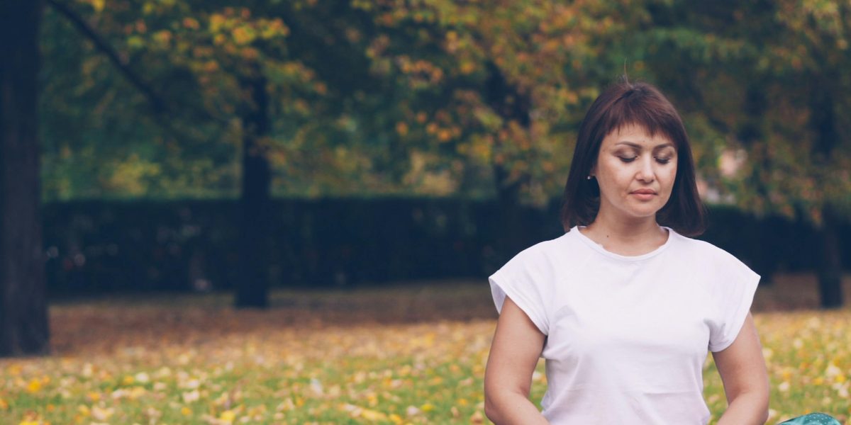 A person practices deep breathing, shifting from stress to a state of calm and relaxation.