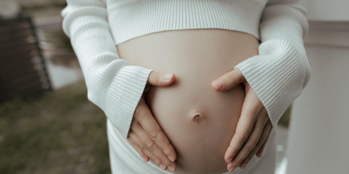 A person demonstrating diaphragmatic breathing, focusing on the expansion of the belly with each inhale.