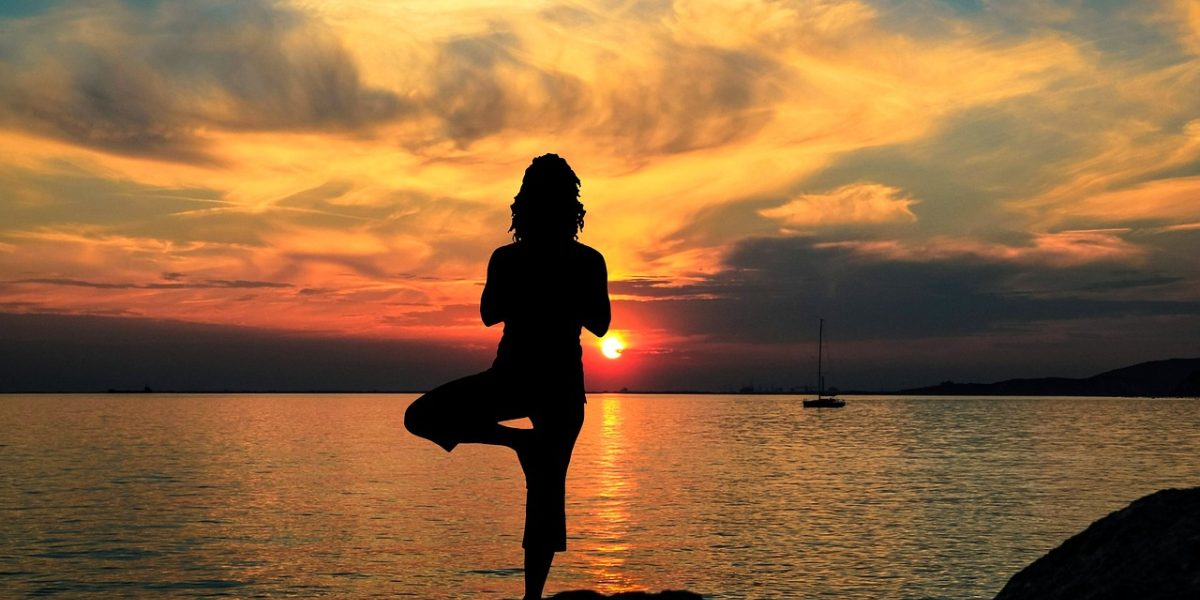 A person engaged in a moment of calm, practicing a deep breathing or mindfulness exercise.