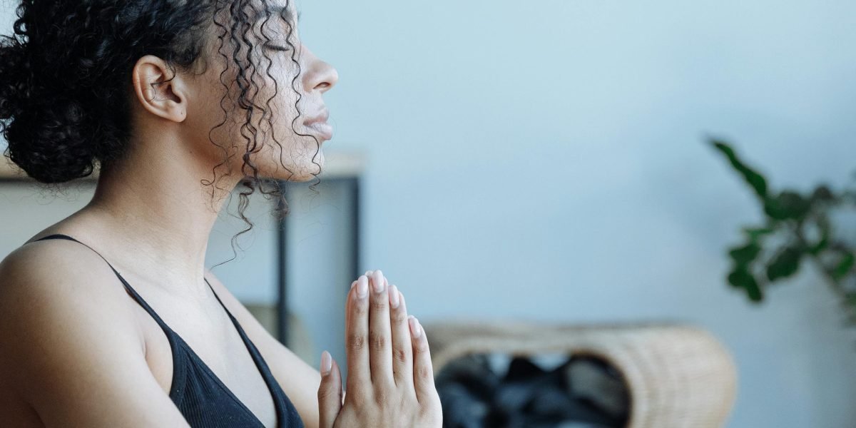 A person finding calm through meditation, representing the brain's rewiring towards letting go of anxious thoughts.