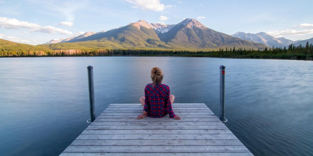 A person experiencing deep relaxation and calm, eyes closed, possibly meditating or drifting to sleep.