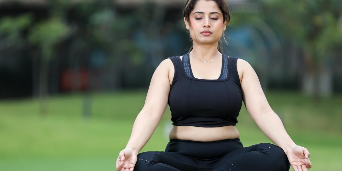 A person engaging in a deep breathing exercise, demonstrating a moment of calm and mindfulness.