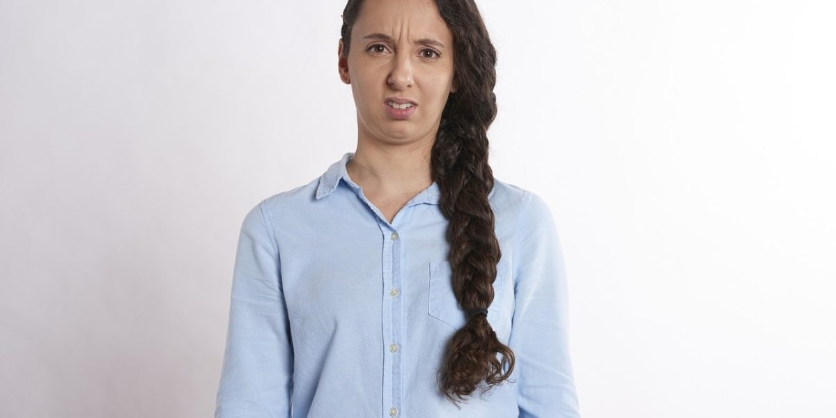 A person experiencing feelings of worry or stress, common precursors to temporary blood pressure changes.