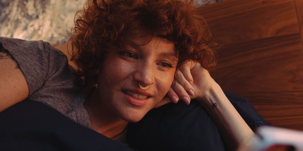A person engaged in a calming pre-sleep routine, setting the stage for restful slumber.