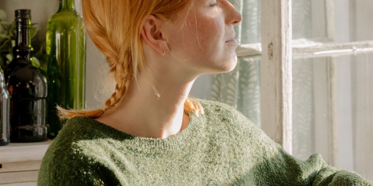 A person finds a moment of calm through focused breathing, highlighting the accessibility of the practice.