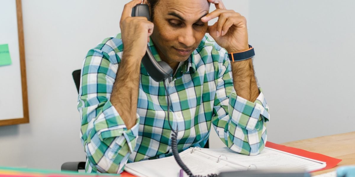 A person demonstrating composure and focus, reflecting effective stress management in a professional setting.