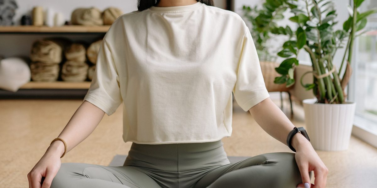 An individual quietly practicing breathing exercises in a calm setting.
