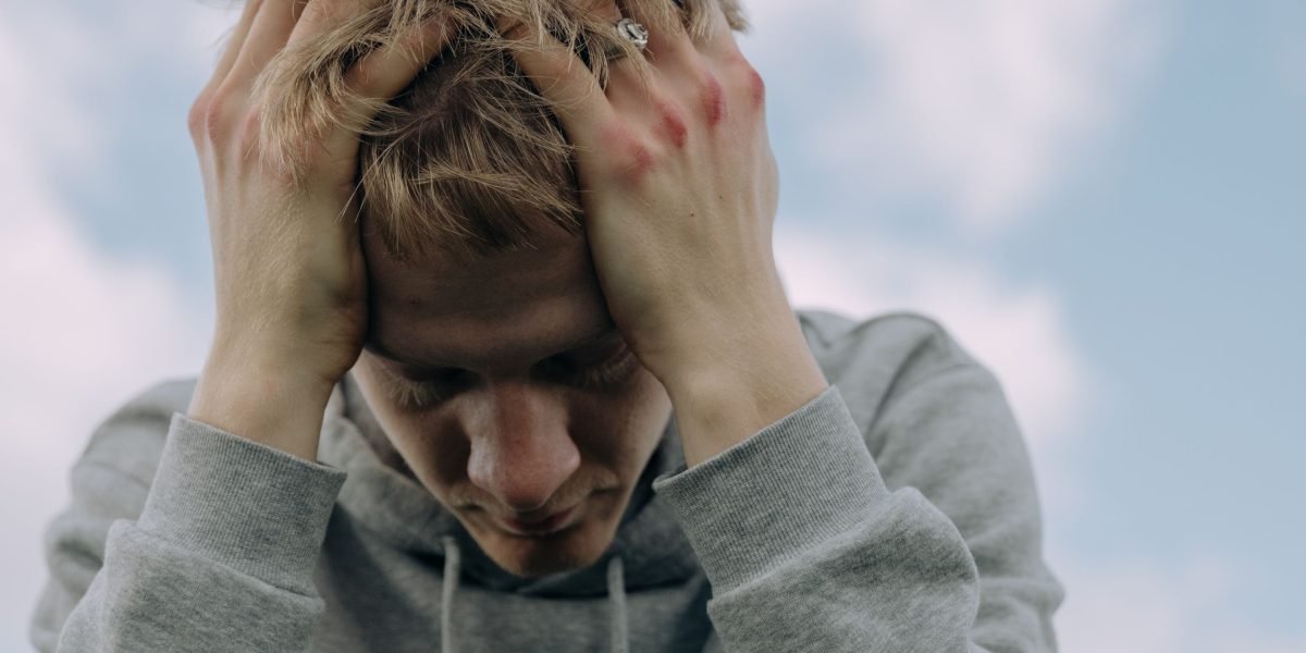 A person feeling the physical sensations of stress and anxiety, highlighting the body's internal battle.