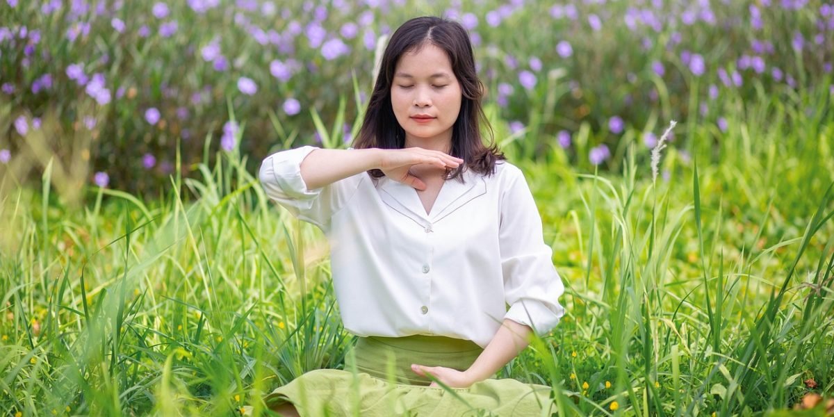 An individual engaging in deep breathing exercises to calm their nervous system and manage stress.