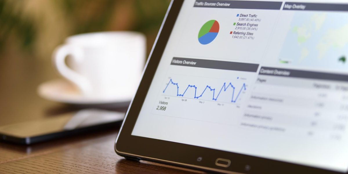 An individual thoughtfully reviewing their personal health data, potentially from a wearable device or health app.