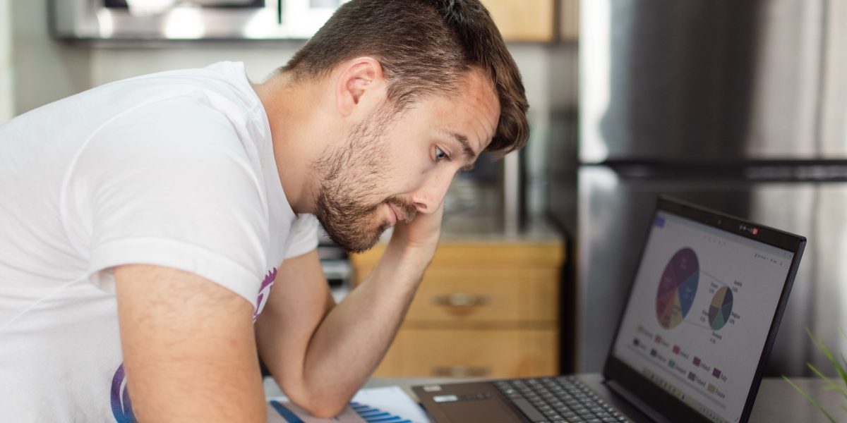 A person reflects on their health readings, contemplating the meaning behind the numbers.