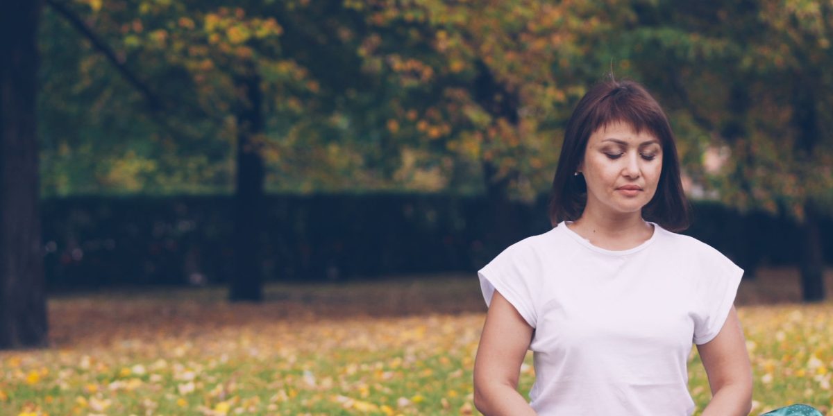 A person engages in a calm breathing exercise, finding peace through mindfulness.