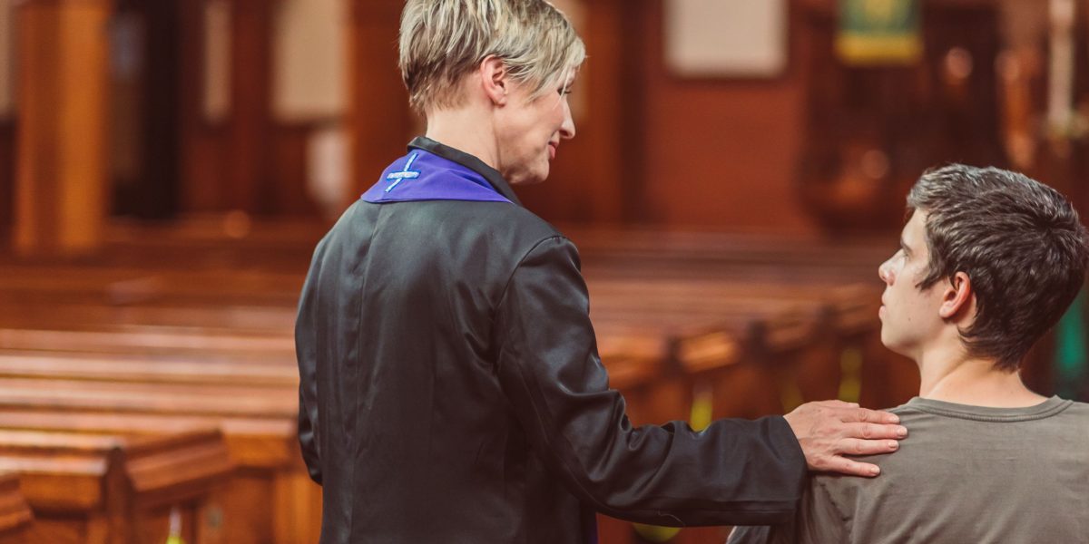 A person receiving encouraging guidance, symbolizing the support and positive reinforcement in behavioral science systems.
