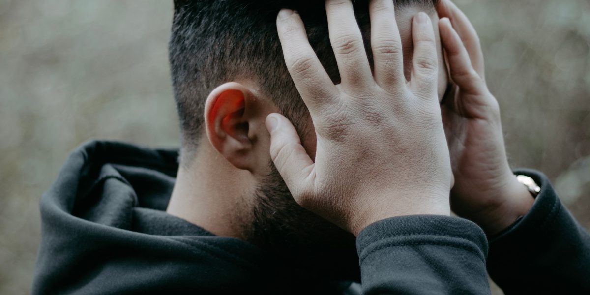 A person feeling overwhelmed, reflecting on the common experience of anxiety and the search for mental health support.