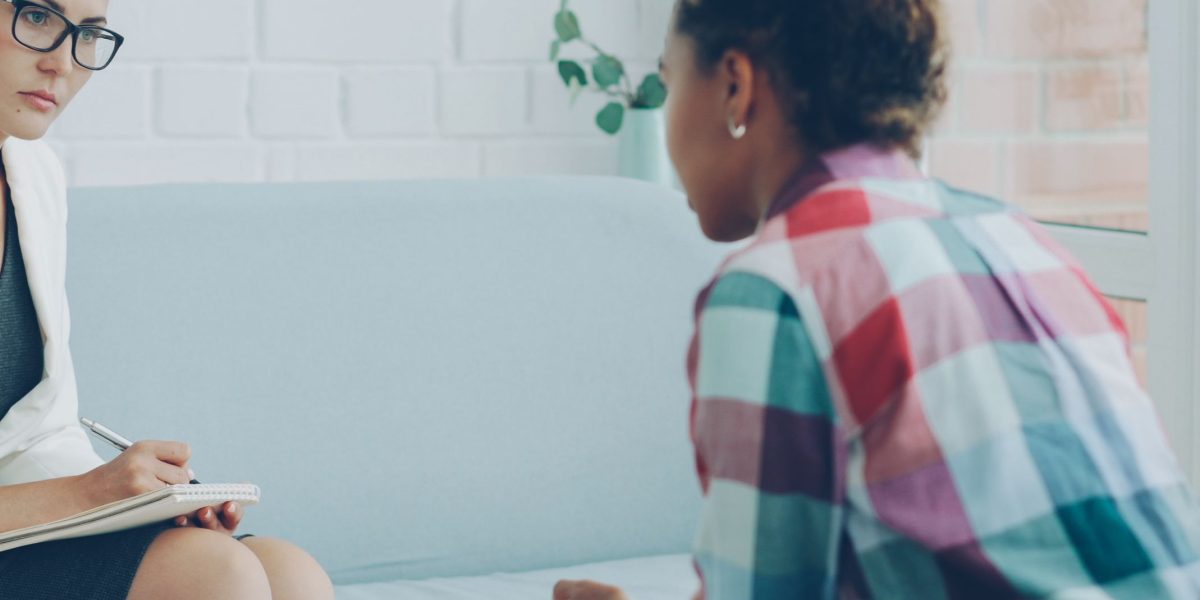 A person having an open conversation with a counselor, illustrating the welcoming and supportive environment of a first appointment at a CMHC.