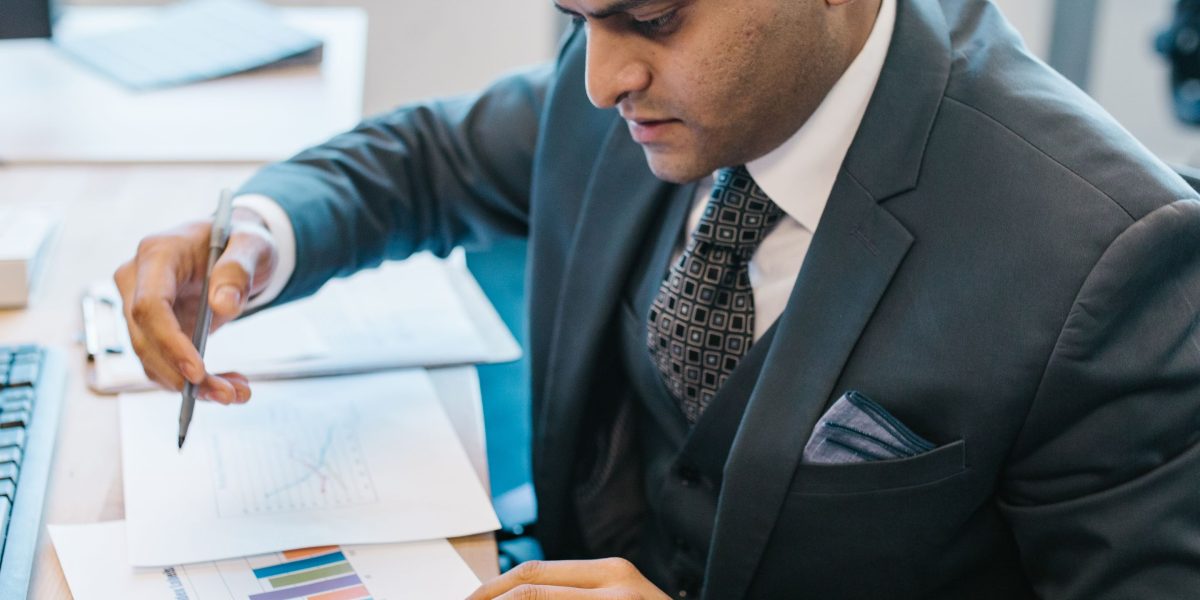 A person reviews data and charts, symbolizing the process of understanding sleep metrics for better health insights.