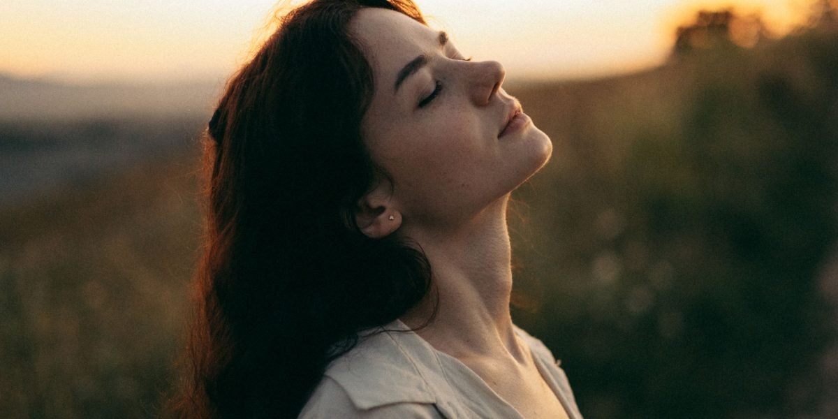 A person experiencing a moment of calm, illustrating the relief found through simple practices.